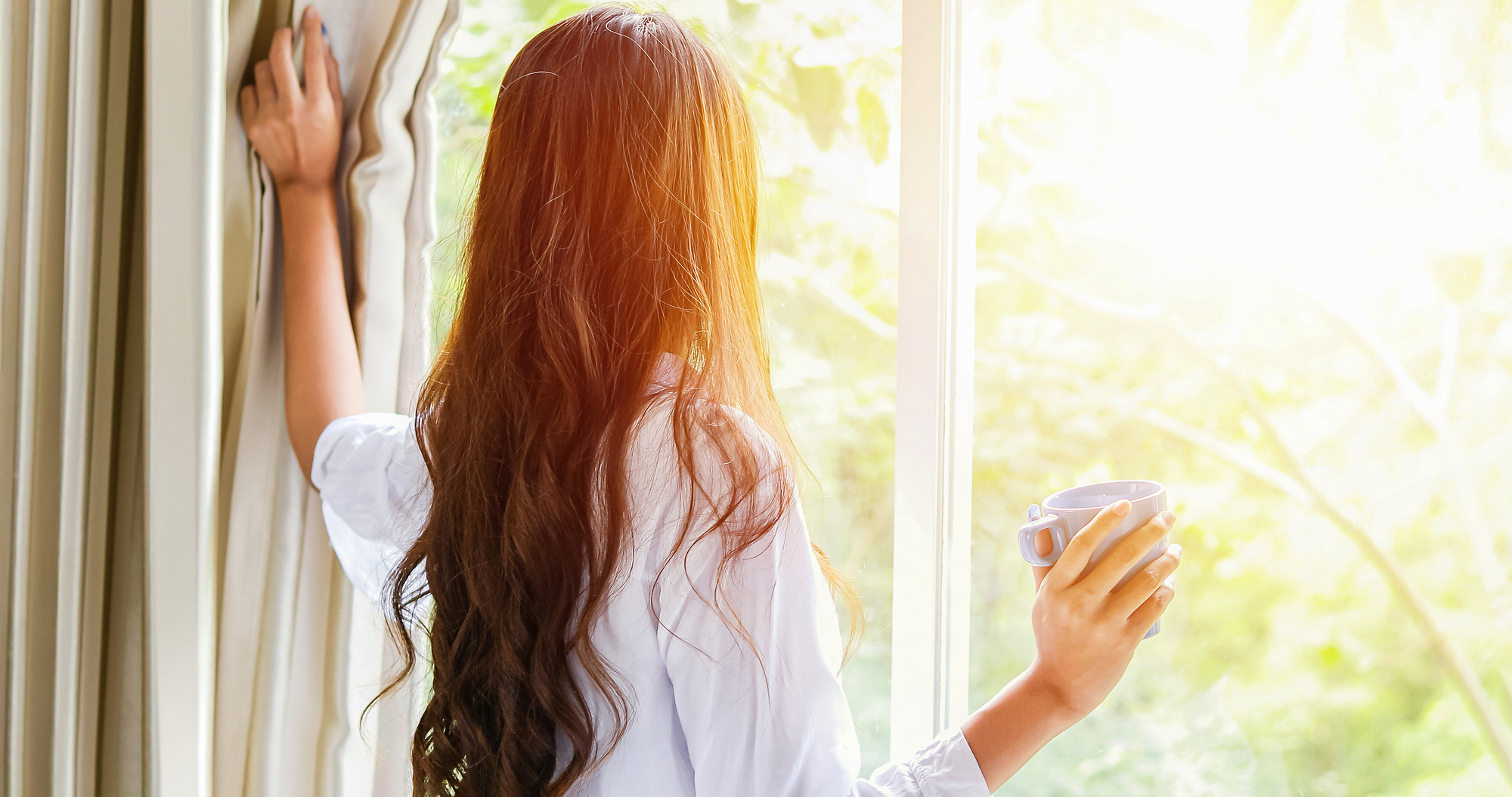 Back View of Woman Looking Outside the Window 