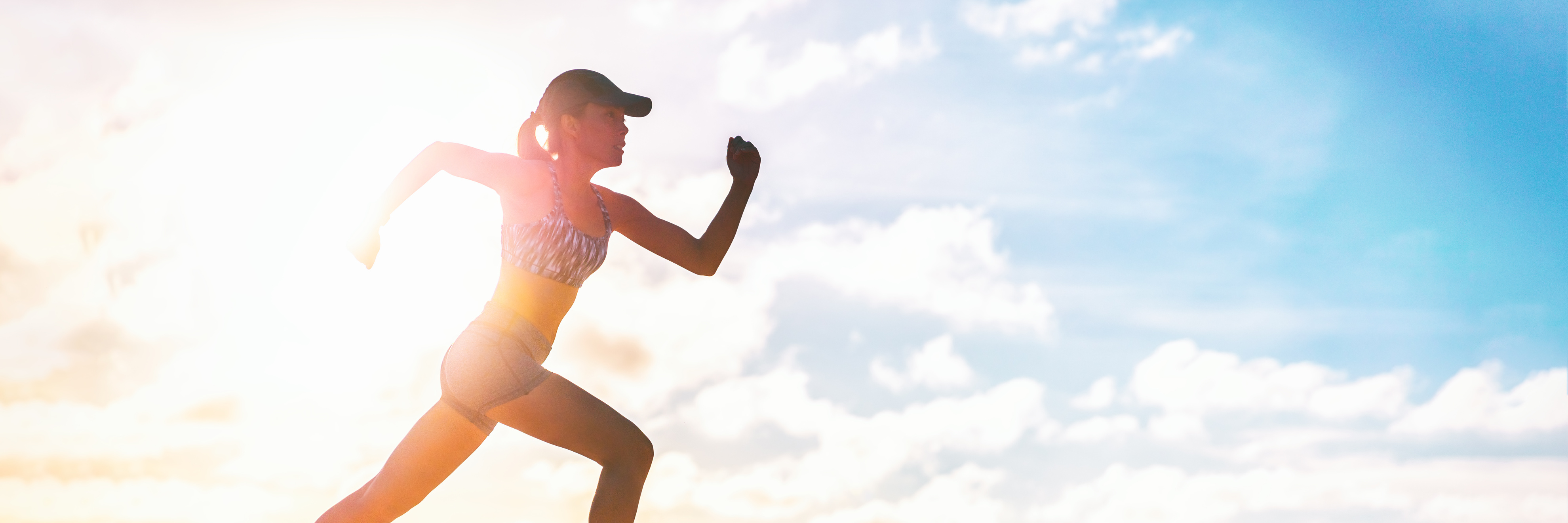 Runner Sprinting Silhouette Training Cardio Exercise in Summer Outdoor Panoramic Banner. Athlete Running outside in Sunset Clouds. Active Lifestyle Workout Fitness Lifestyle. Banner Panorama